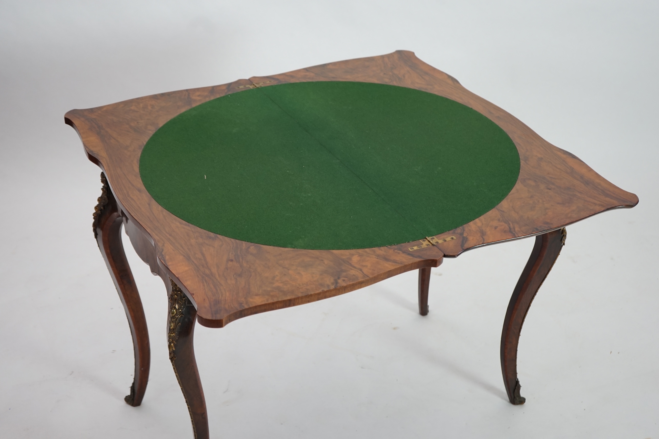 A Victorian marquetry inlaid burr walnut card table